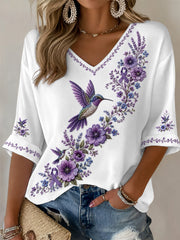 Damen-T-Shirt in Lila mit Blumen- und Kolibri-Print, halblangen Ärmeln und V-Ausschnitt – Unterstützung für das Bewusstsein rund um die Alzheimer-Krankheit
