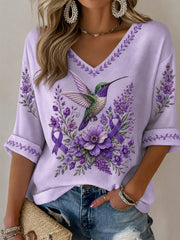 Damen-T-Shirt in Lila mit Blumen- und Kolibri-Print, halblangen Ärmeln und V-Ausschnitt – Unterstützung für das Bewusstsein rund um die Alzheimer-Krankheit