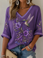 Damen-T-Shirt in Lila mit Blumen- und Kolibri-Print, halblangen Ärmeln und V-Ausschnitt – Unterstützung für das Bewusstsein rund um die Alzheimer-Krankheit
