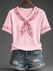 Damen-T-Shirt mit rosa Schleife und floralem Kunstprint