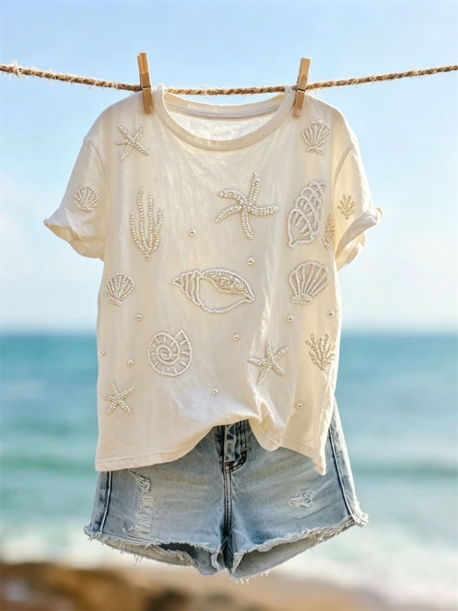 Damen-edles Kunstprint-T-Shirt mit Seesternen, Muscheln und Perlen, kurzärmelig